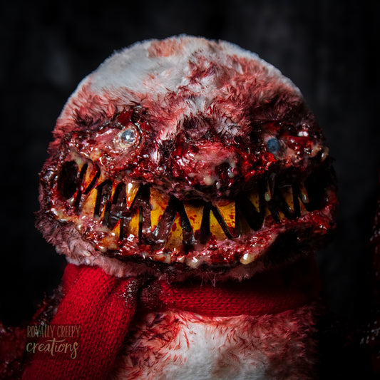 Gory bird creature-like figure with red accents and a dark background