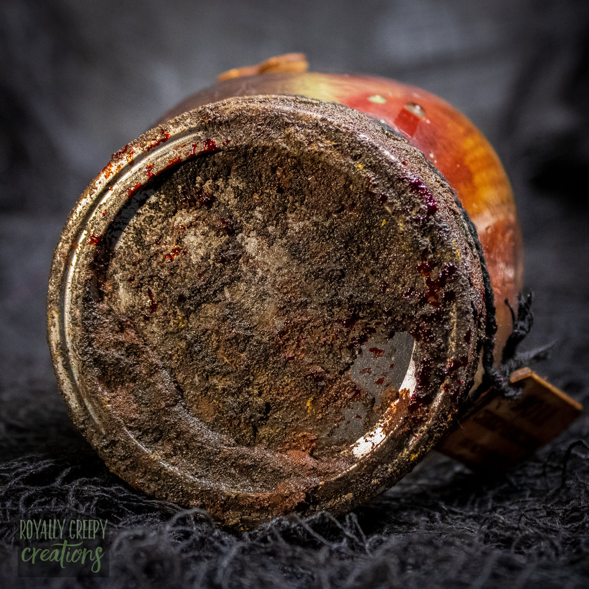 A close-up of a rusty jar lid.