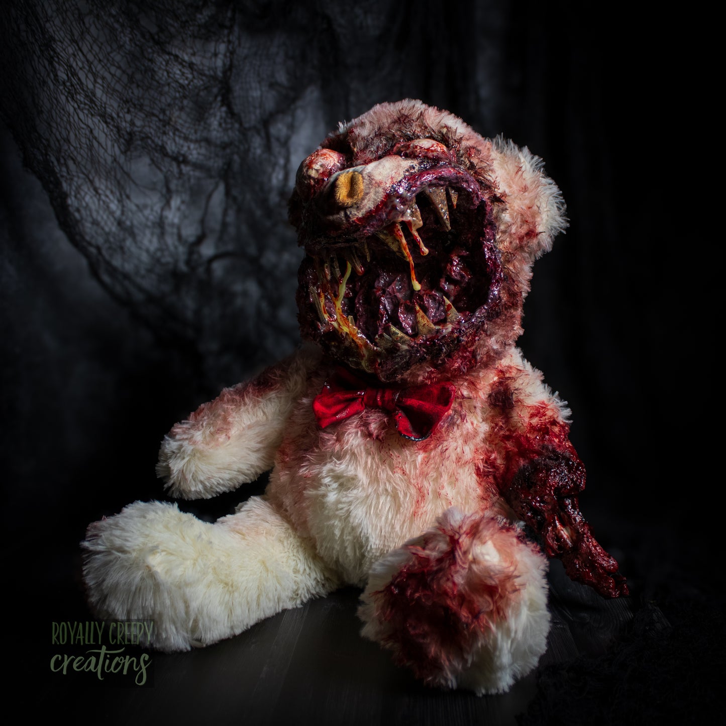 Creepy teddy bear with sharp teeth and gore details.