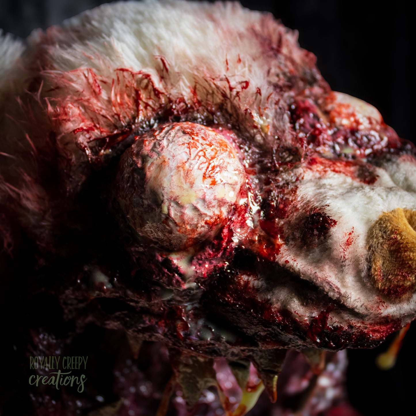 Close-up of creepy teddy bear bloodshot eyeball.