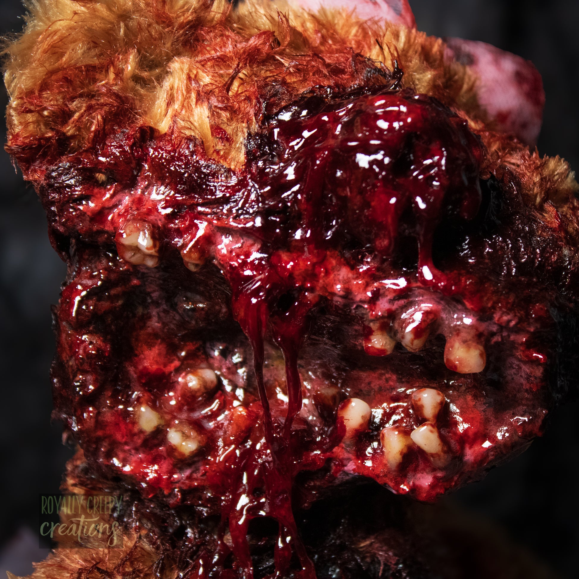 Close-up of horror teddy bear's exposed teeth.