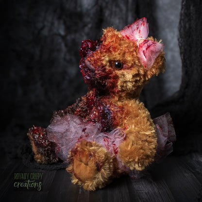Left side view of horror teddy bear.