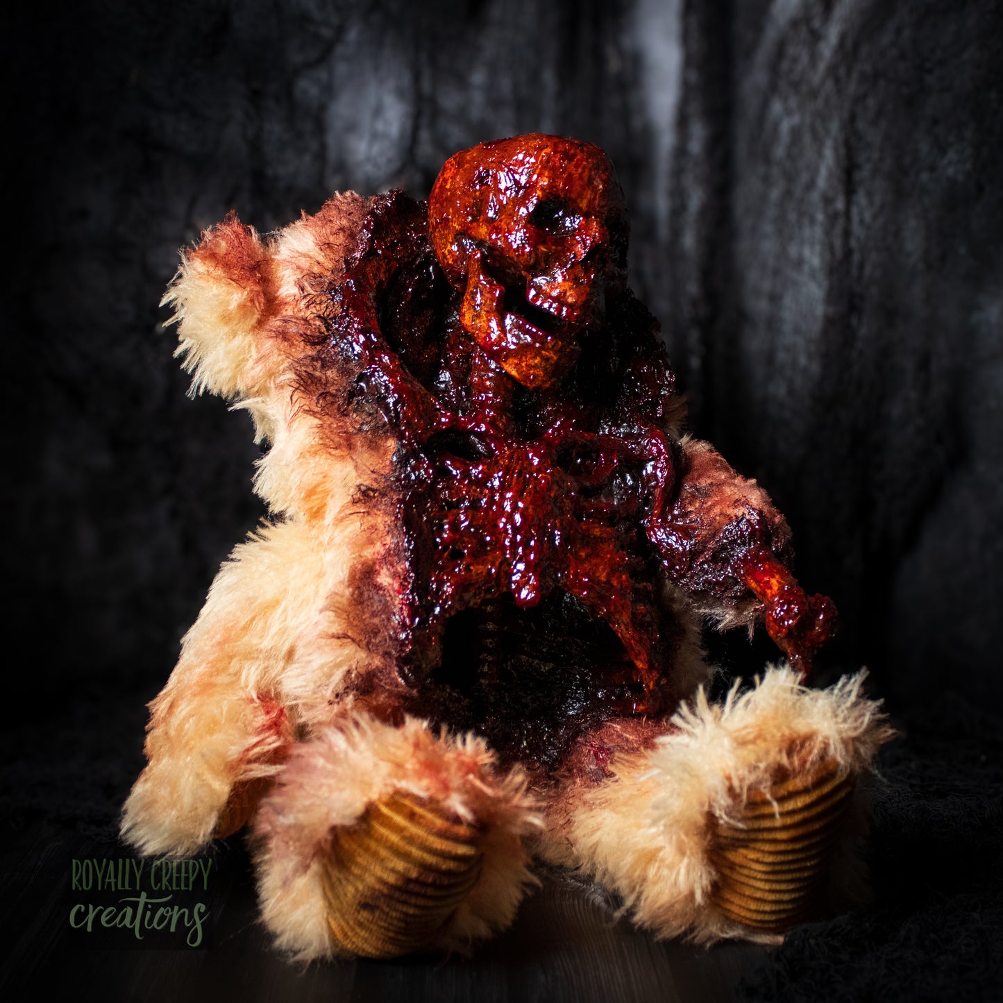 Horror themed teddy bear torn open on the front with a gory skeleton emerging from it's body.