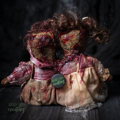 Backside view of conjoined horror doll.