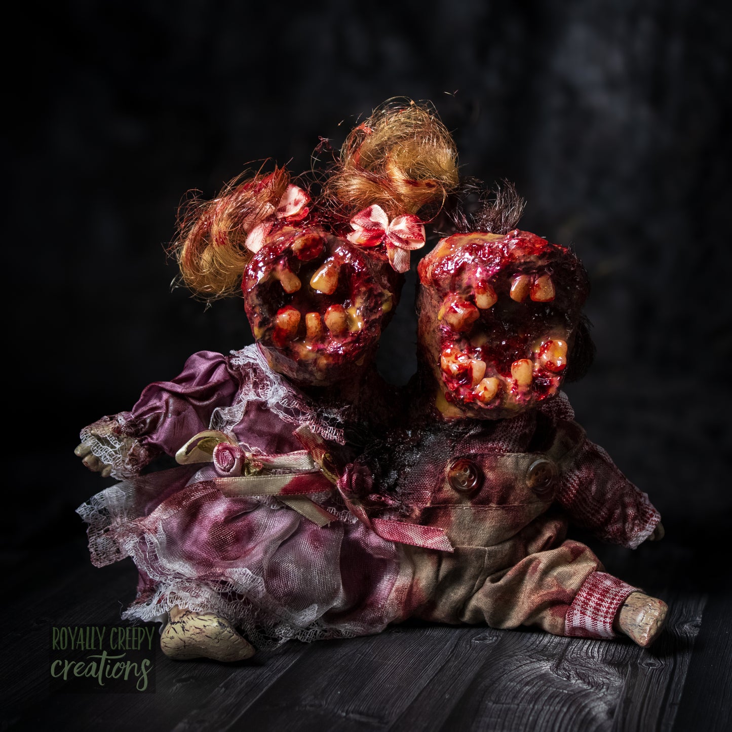 Artistic conjoined horror doll with a gaping mouth filled with teeth covering both faces.