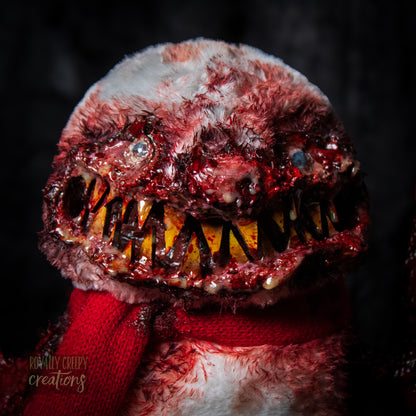 Close up of horror bird creature's face showing it's sharp teeth.
