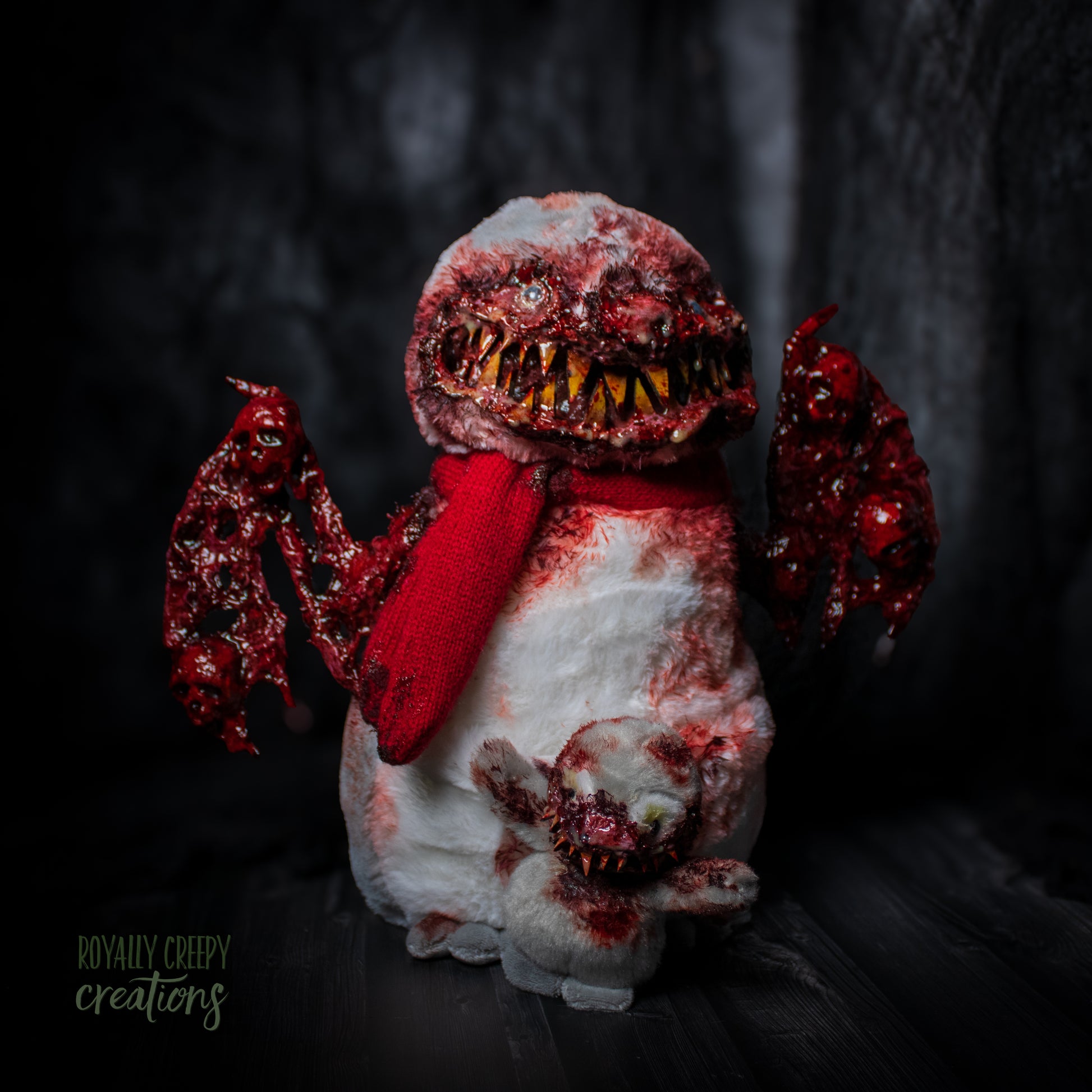 Horror-themed bird penguin with big bloody wings and a baby penguin in front of it
