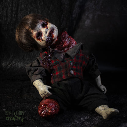 A creepy horror doll with a grotesque bloody wound on the neck, posed on a dark textured background with a severed grotesque leg.