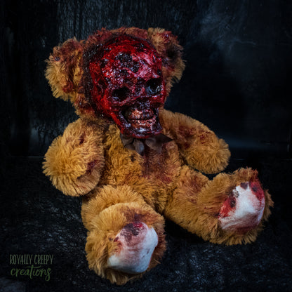 Gory horror teddy bear with an exposed bloody skull for a face