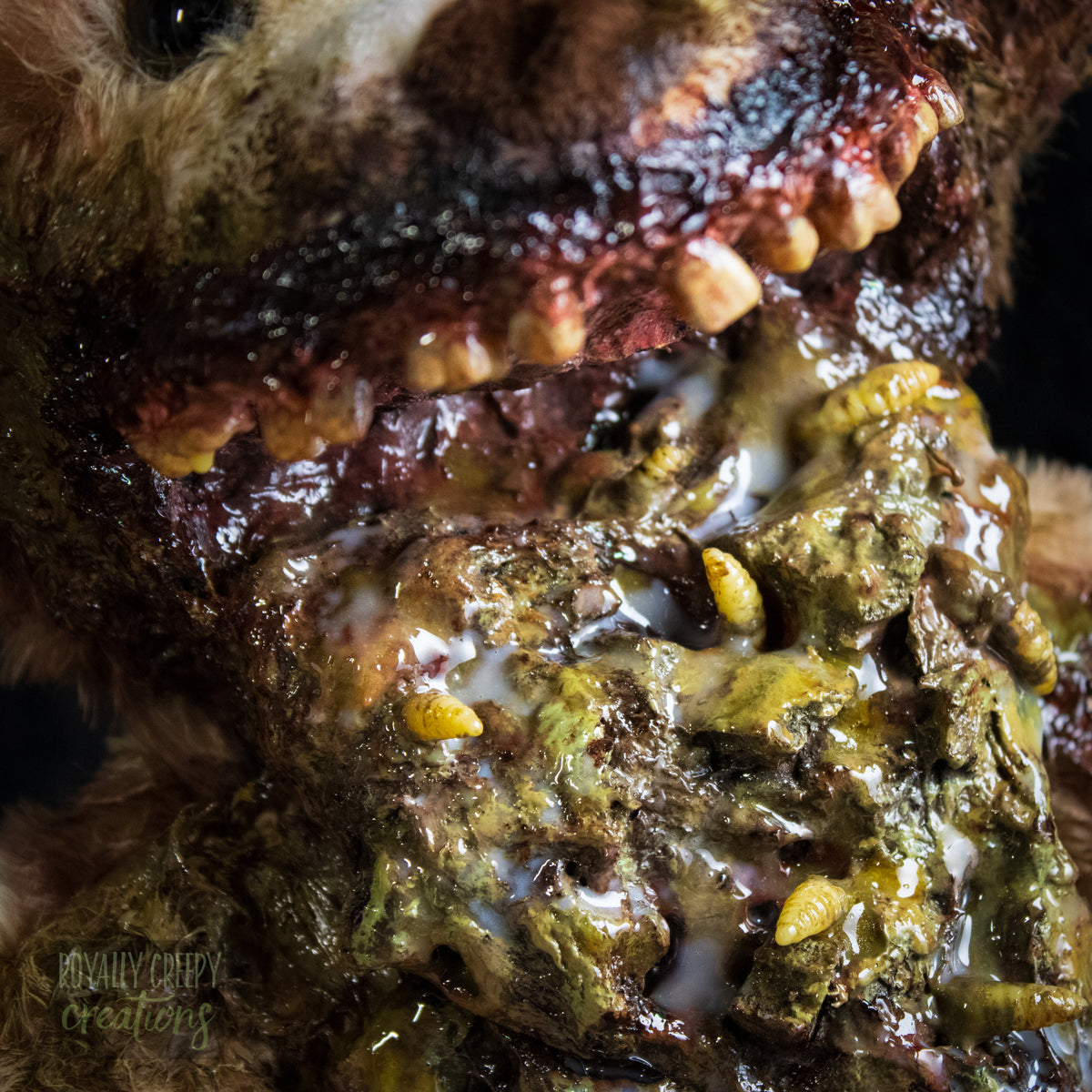 Close-up of a horror-themed teddy bear mouth with exposed vomit.