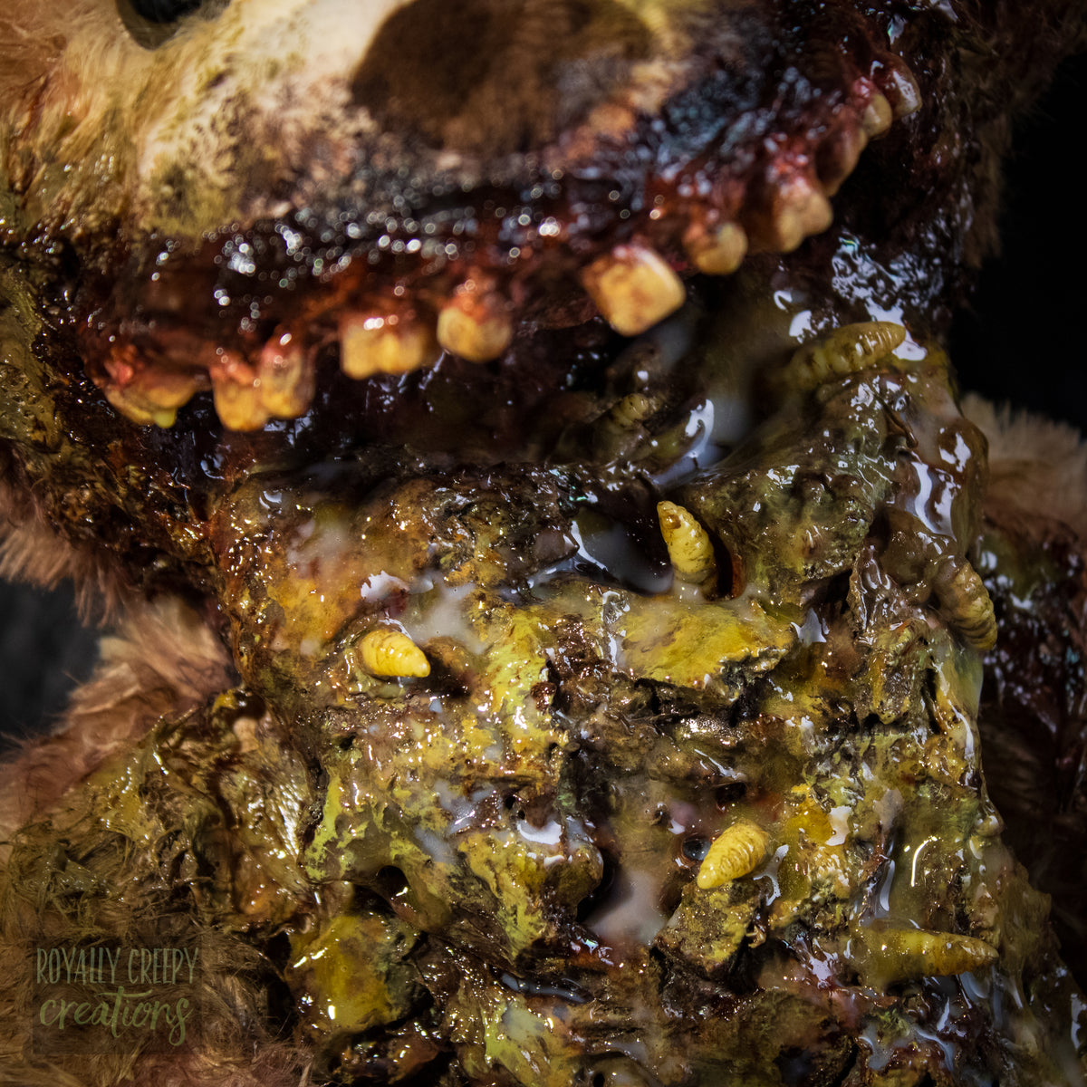 Close-up of a horror-themed teddy bear mouth with exposed vomit.