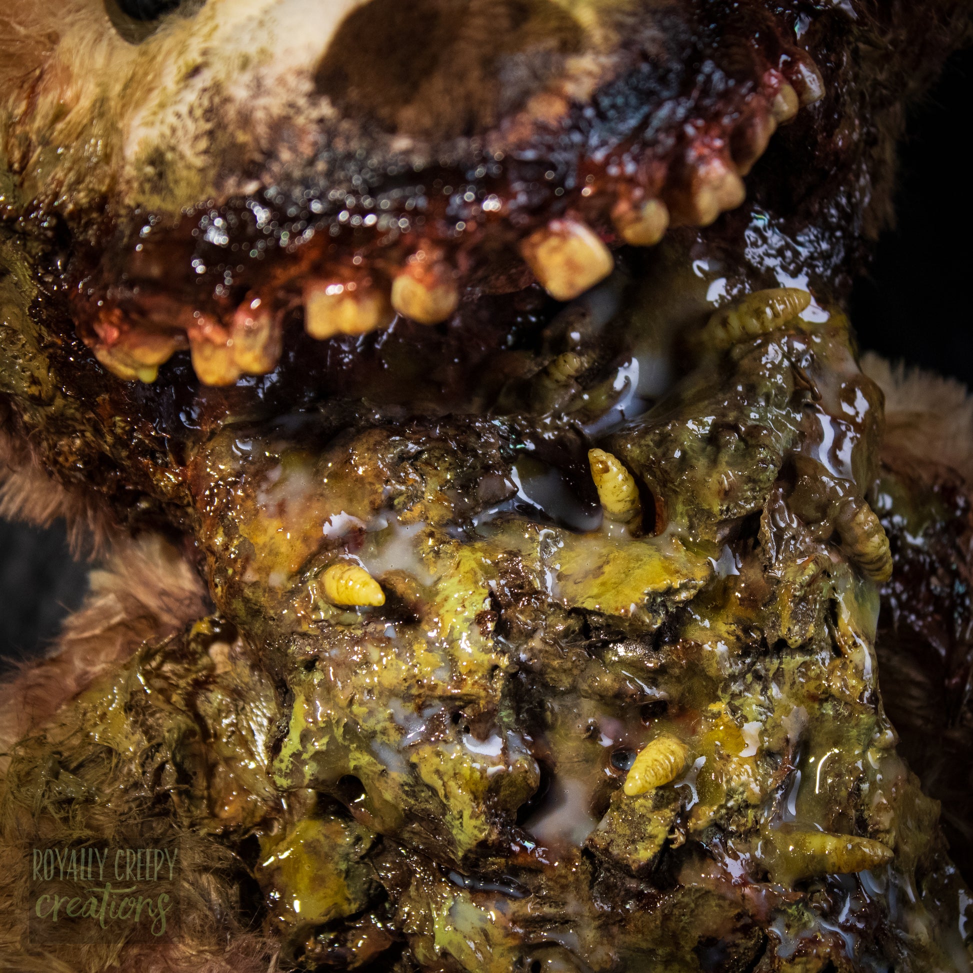 Close-up of a horror-themed teddy bear mouth with exposed vomit.