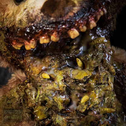 Close-up of a horror-themed teddy bear mouth with exposed vomit.