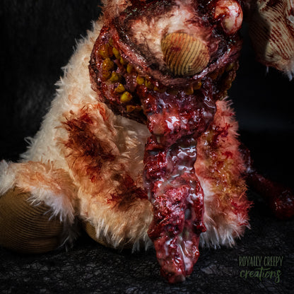 A close-up of horror-themed zombie dog's protruding tongue, posed against a dark textured background