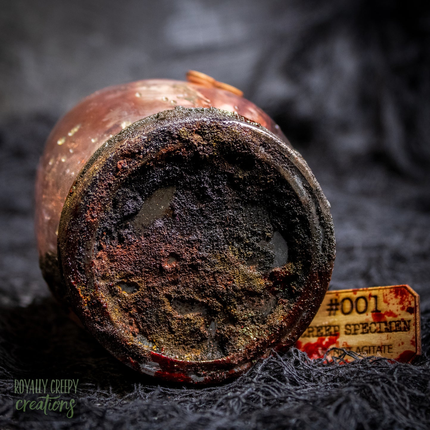 A close up of a rusty jar lid.
