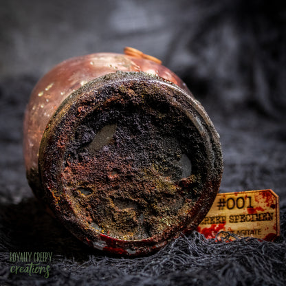 A close up of a rusty jar lid.