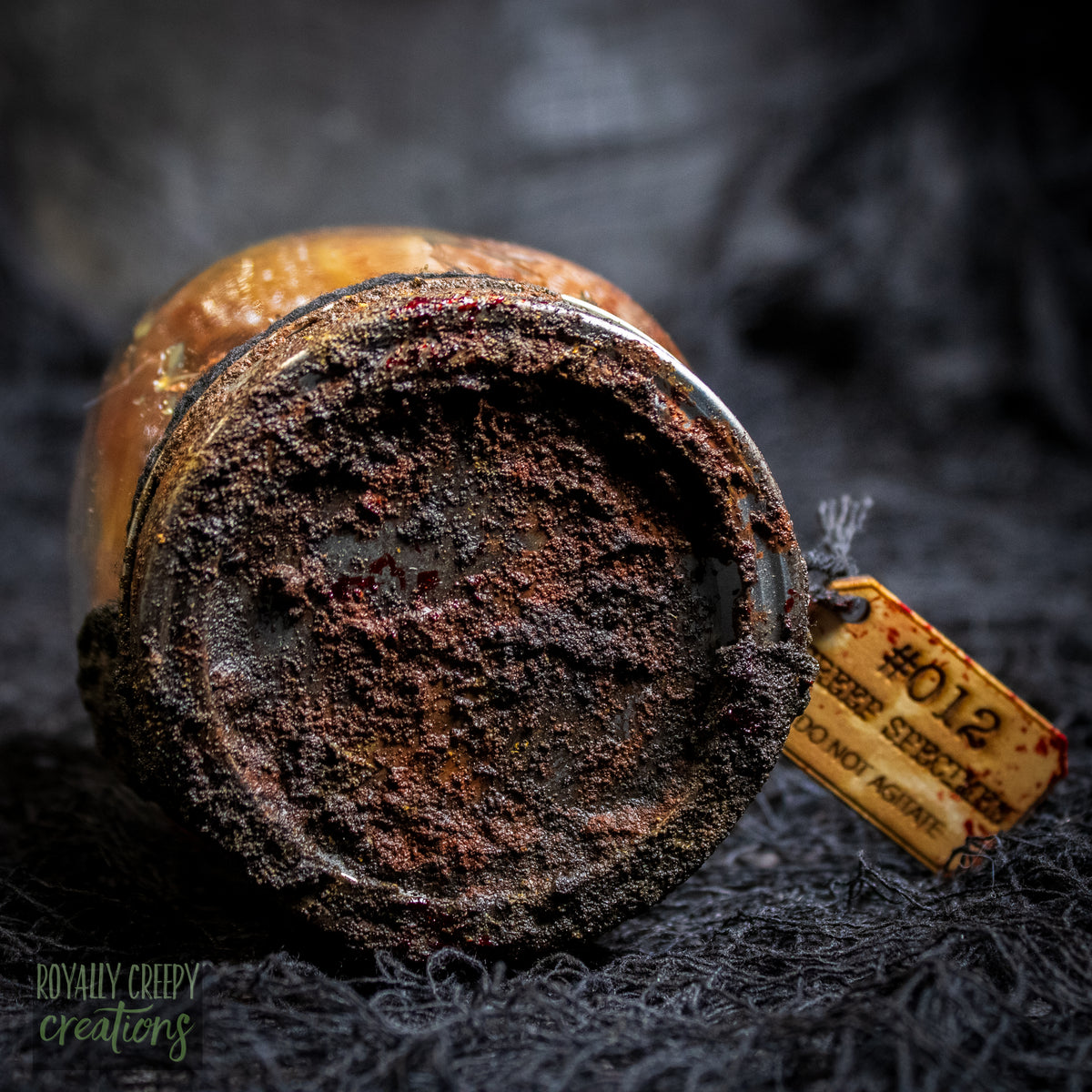 A close-up of a rusty jar lid.
