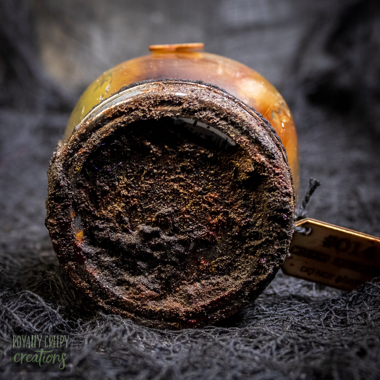A close-up of a rusty jar lid.