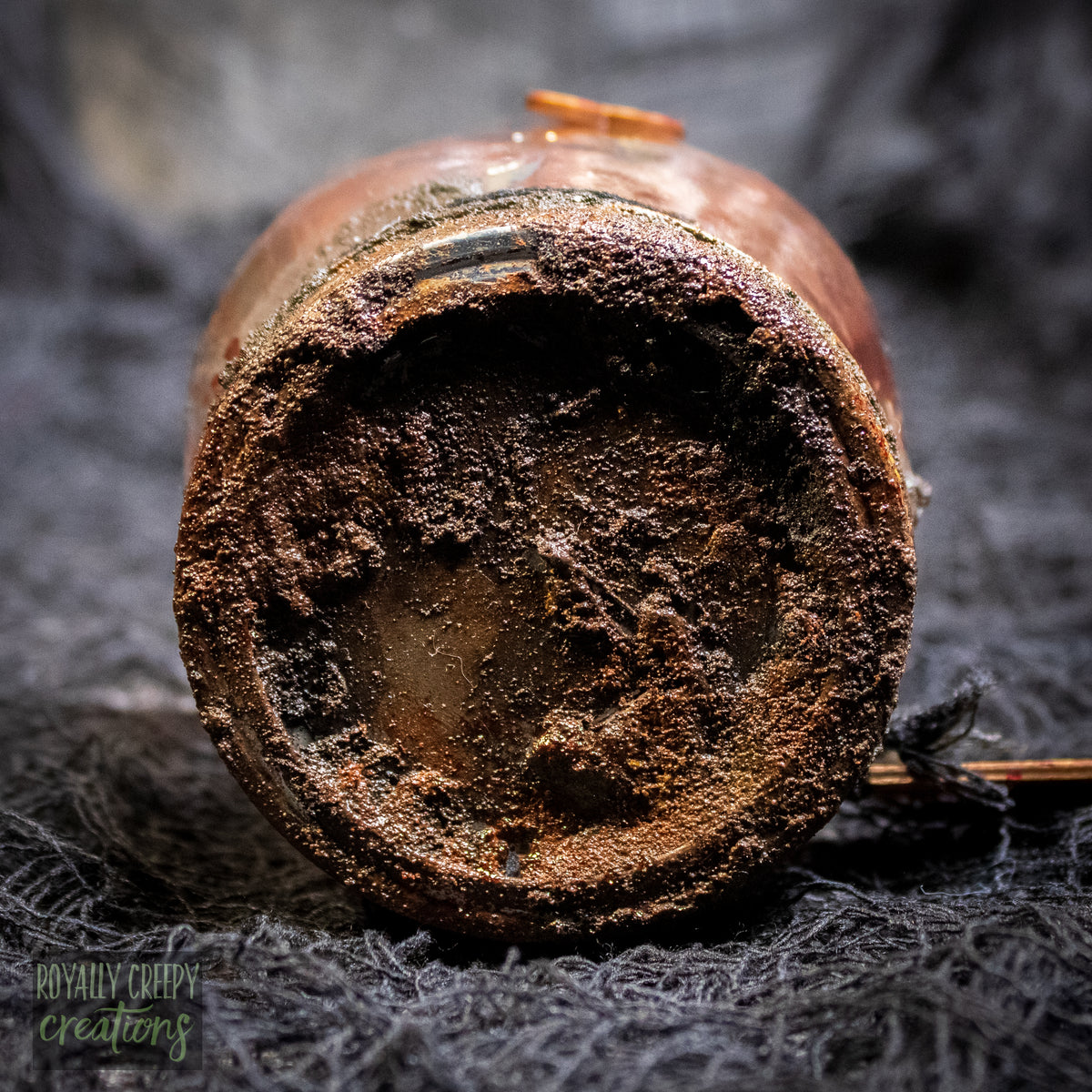 a close-up of a rusty jar lid.