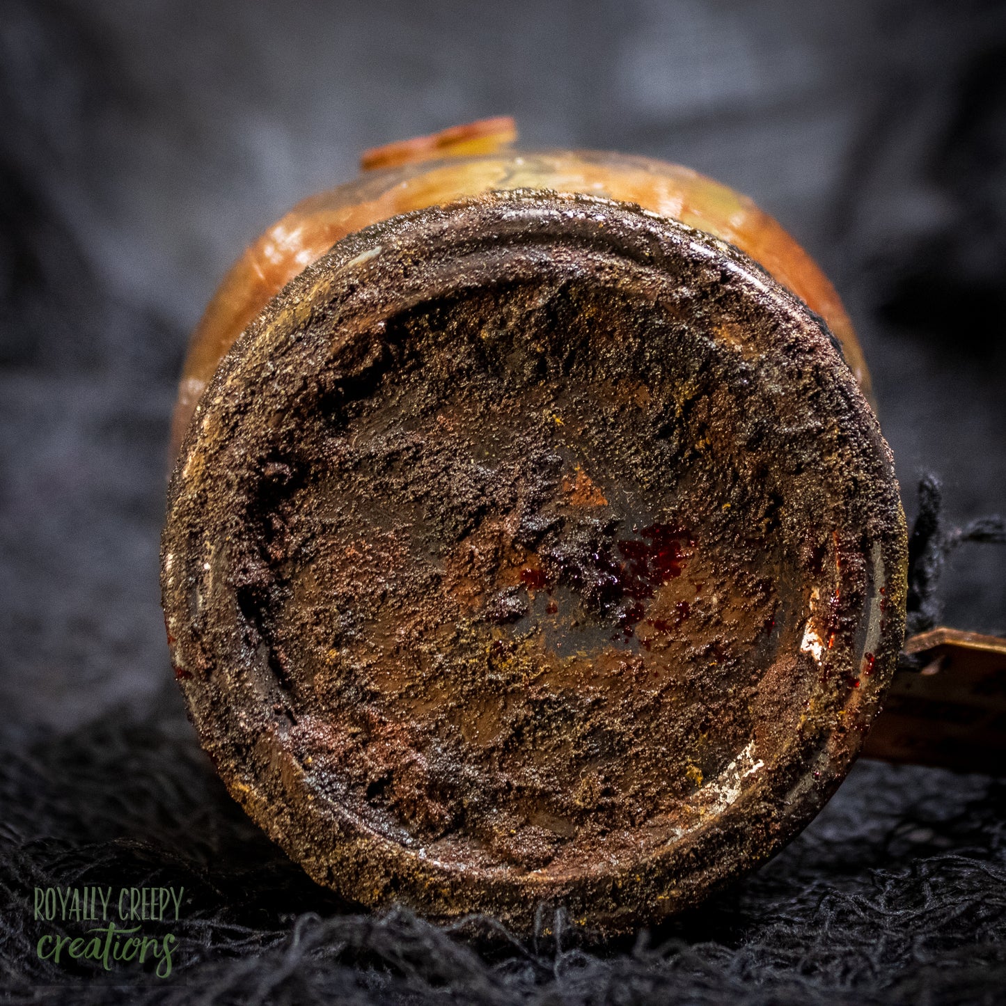A close-up of a rusty jar lid.