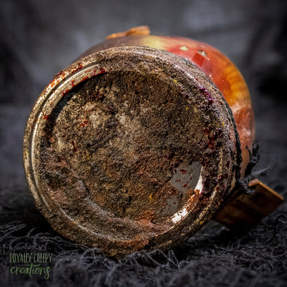 A close-up of a rusty jar lid.