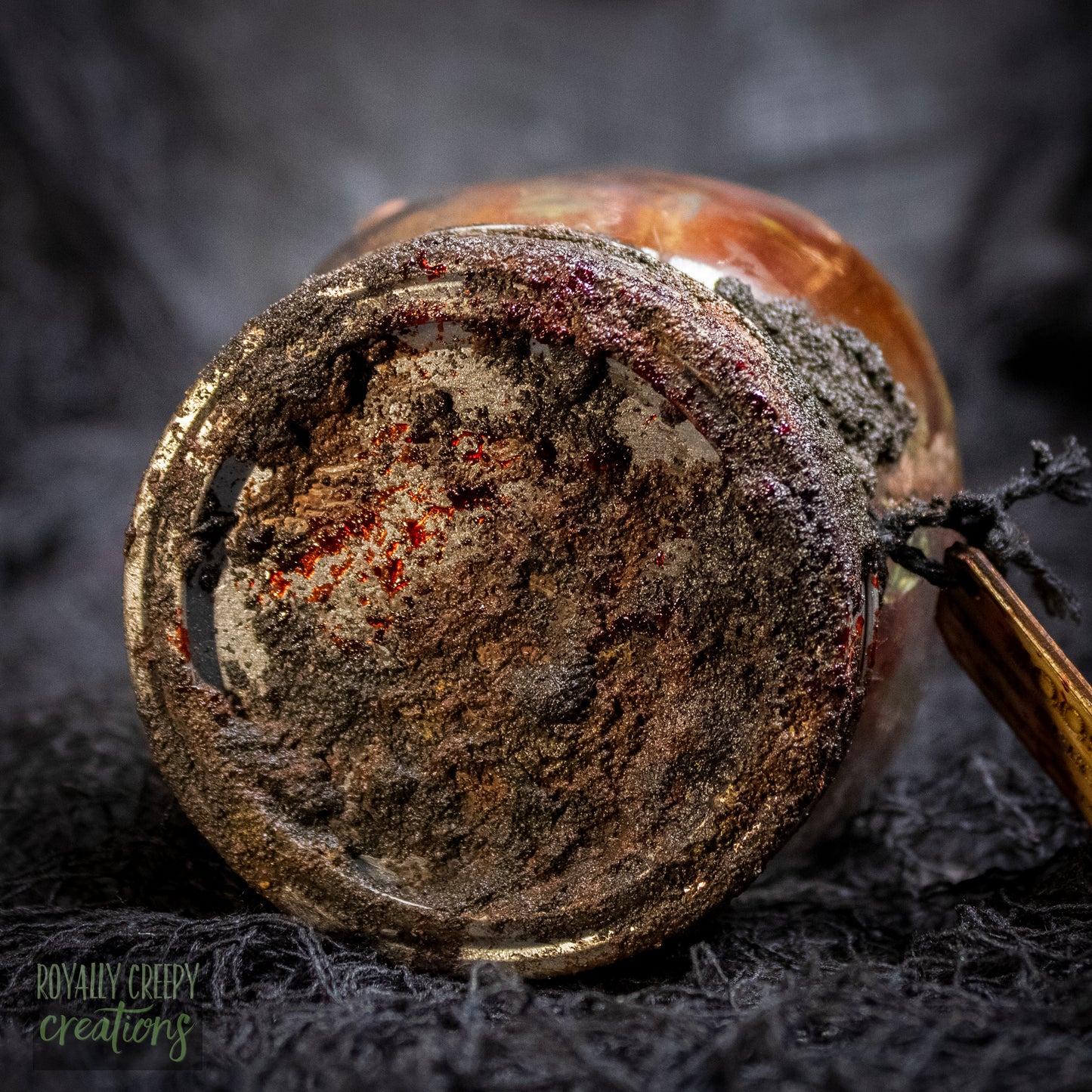 A close-up of a rusty jar lid.