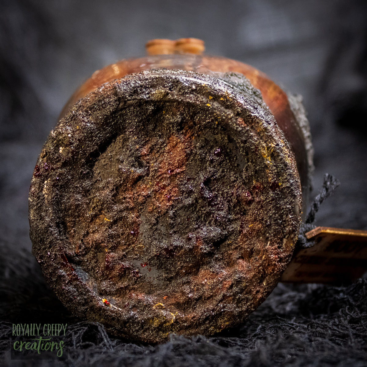A close-up of a rusty jar lid.