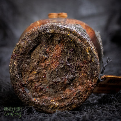 A close-up of a rusty jar lid.